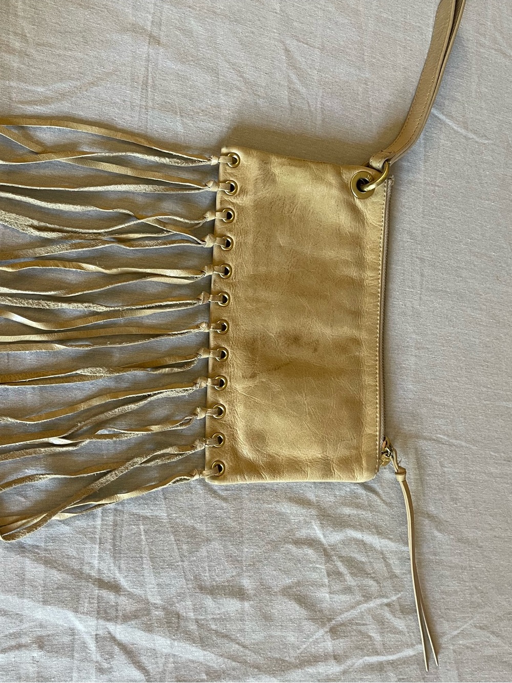 Taupe leather wristlet clutch with fringe. Very boho